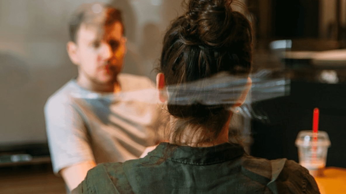 Two people facing each other in a face-to-face interview